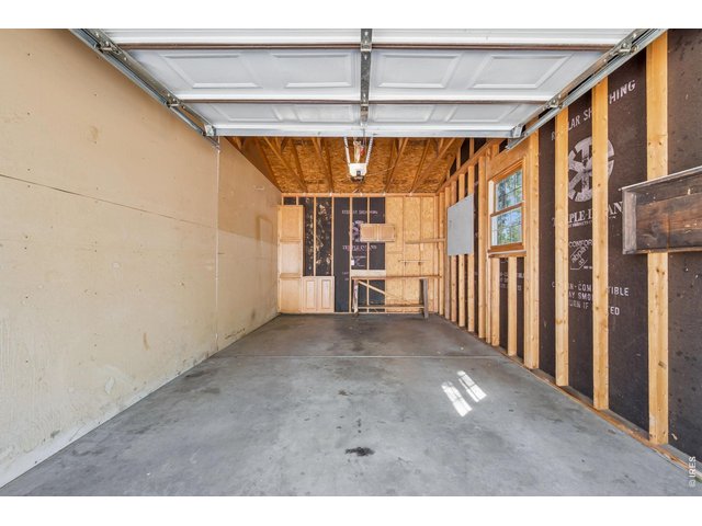 Property Photo 25 1 car garage with shelving and garage door opener