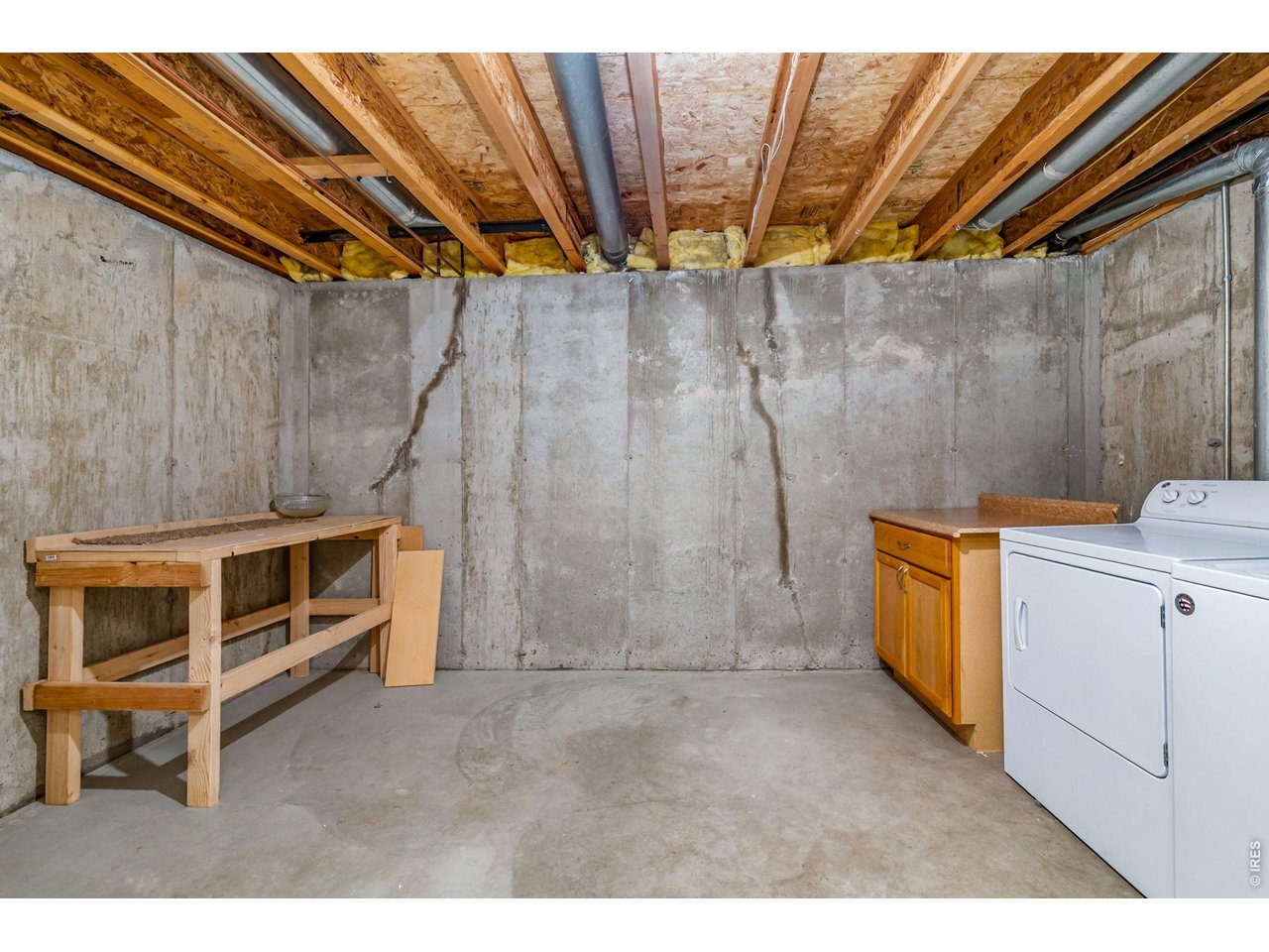 Property Photo 23 Laundry with bench in basement