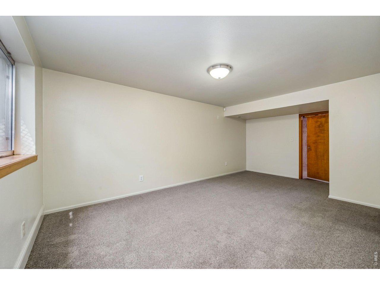 Property Photo 21 Family room in basement is 18.8 x 11