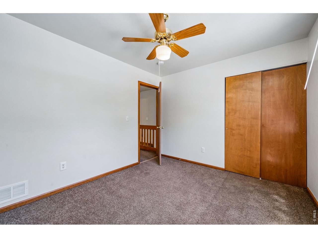 Property Photo 18 2nd bedroom with ceiling fan