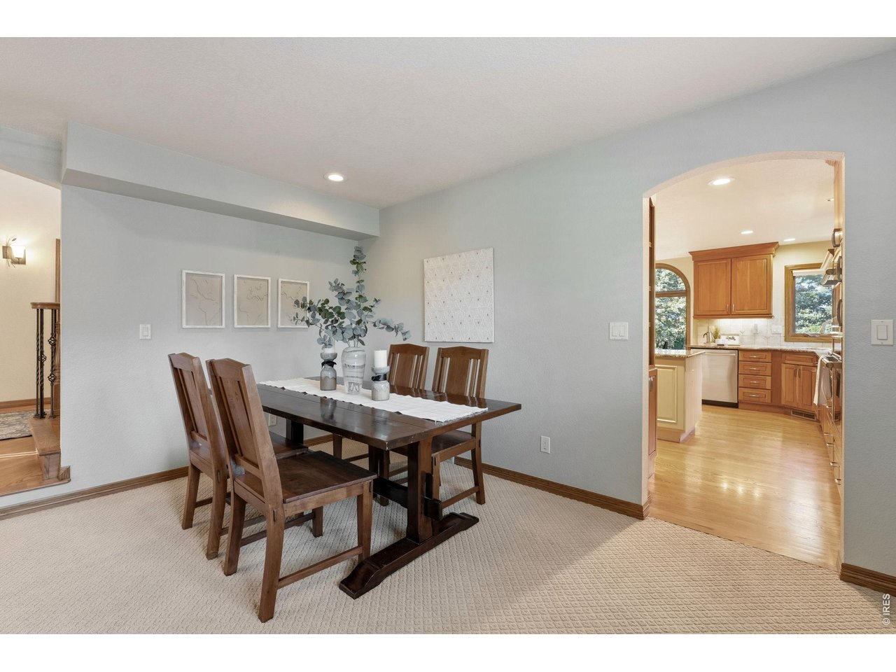 Property Photo 8 Formal Dining Room Elegant dining space flows seamlessly into the gourmet kitchen, perfect for entertaining