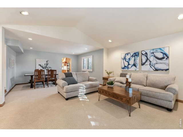 Property Photo 7 The generously sized living room makes the perfect place to gather and unwind.
