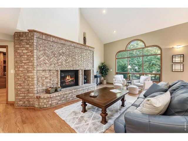 Property Photo 12 This herringbone brick fireplace is the heart of the home.