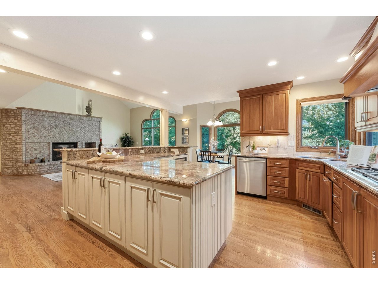 Property Photo 14 This home is designed to entertain, with an expansive island offering prep space, storage, seating and room for everyone to gather.
