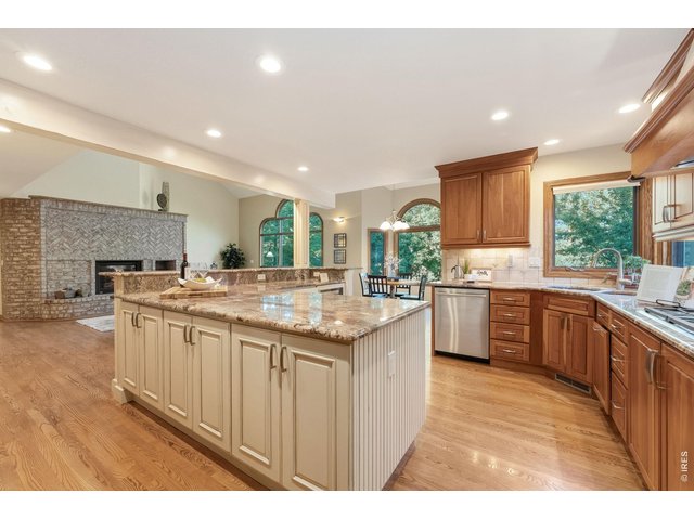 Property Photo 14 This home is designed to entertain, with an expansive island offering prep space, storage, seating and room for everyone to gather.