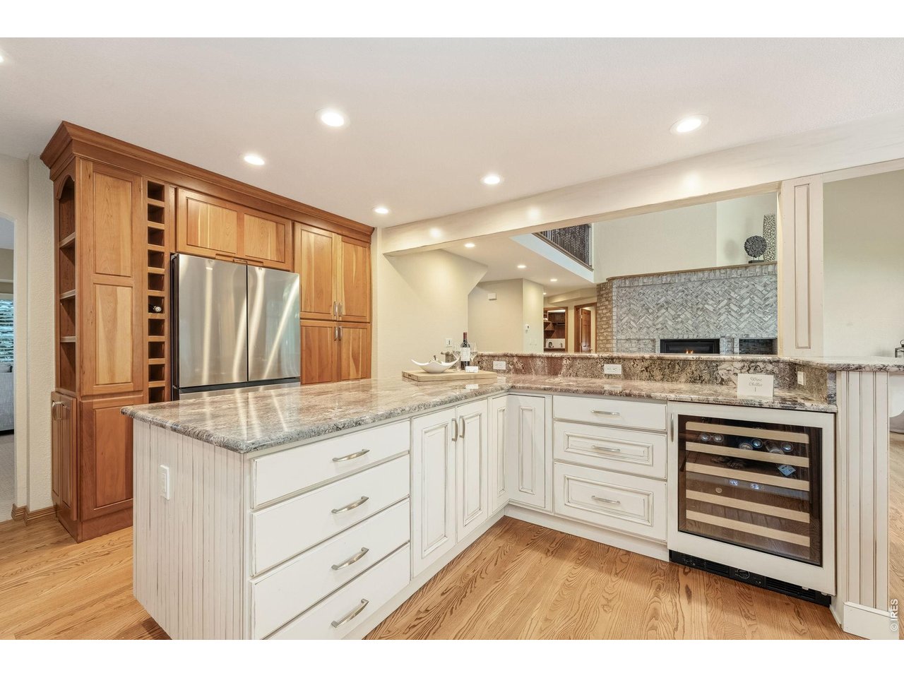 Property Photo 15 Granite counters, custom cherry cabinetry and top-tier appliances and a wine chiller make this kitchen a chef's dream.