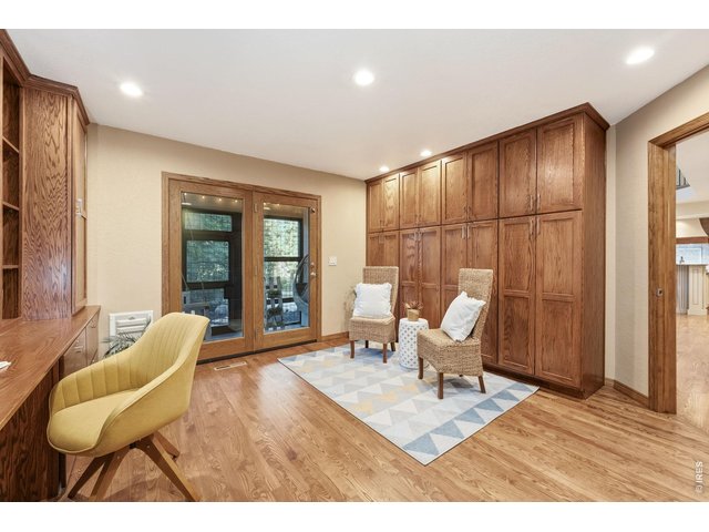 Property Photo 35 Beautiful built-ins, warm wood finishes, and private patio access create an inspiring workspace.
