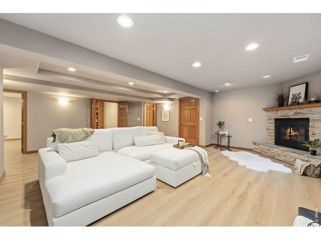 Property Photo 39 The expansive family room offers endless possibilities for movie nights, game days, and entertaining.