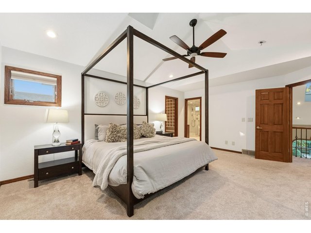 Property Photo 21 Spacious and inviting, the primary suite offers vaulted ceilings and plenty of room to unwind.