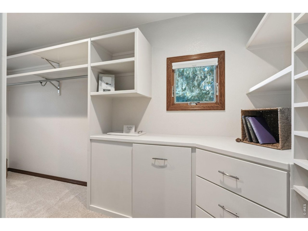 Property Photo 29 Designed for organization with built-in cabinetry, generous shelving, and a convenient laundry chute.