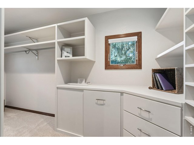 Property Photo 29 Designed for organization with built-in cabinetry, generous shelving, and a convenient laundry chute.