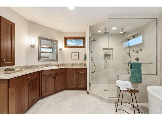 Property Photo 25 Heated tile floors, dual vanities, an oversized shower, and an air jetted soaking tub,
