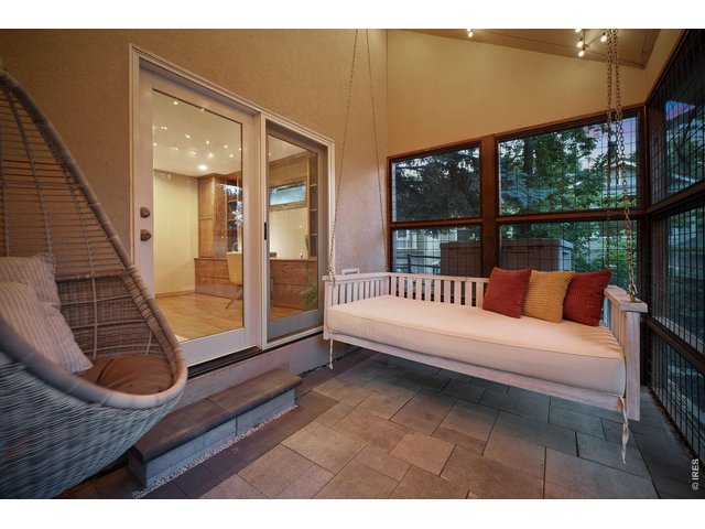 Property Photo 34 Step outside to the screened and covered patio, a peaceful retreat for morning coffee, afternoon work breaks, or quiet evenings.