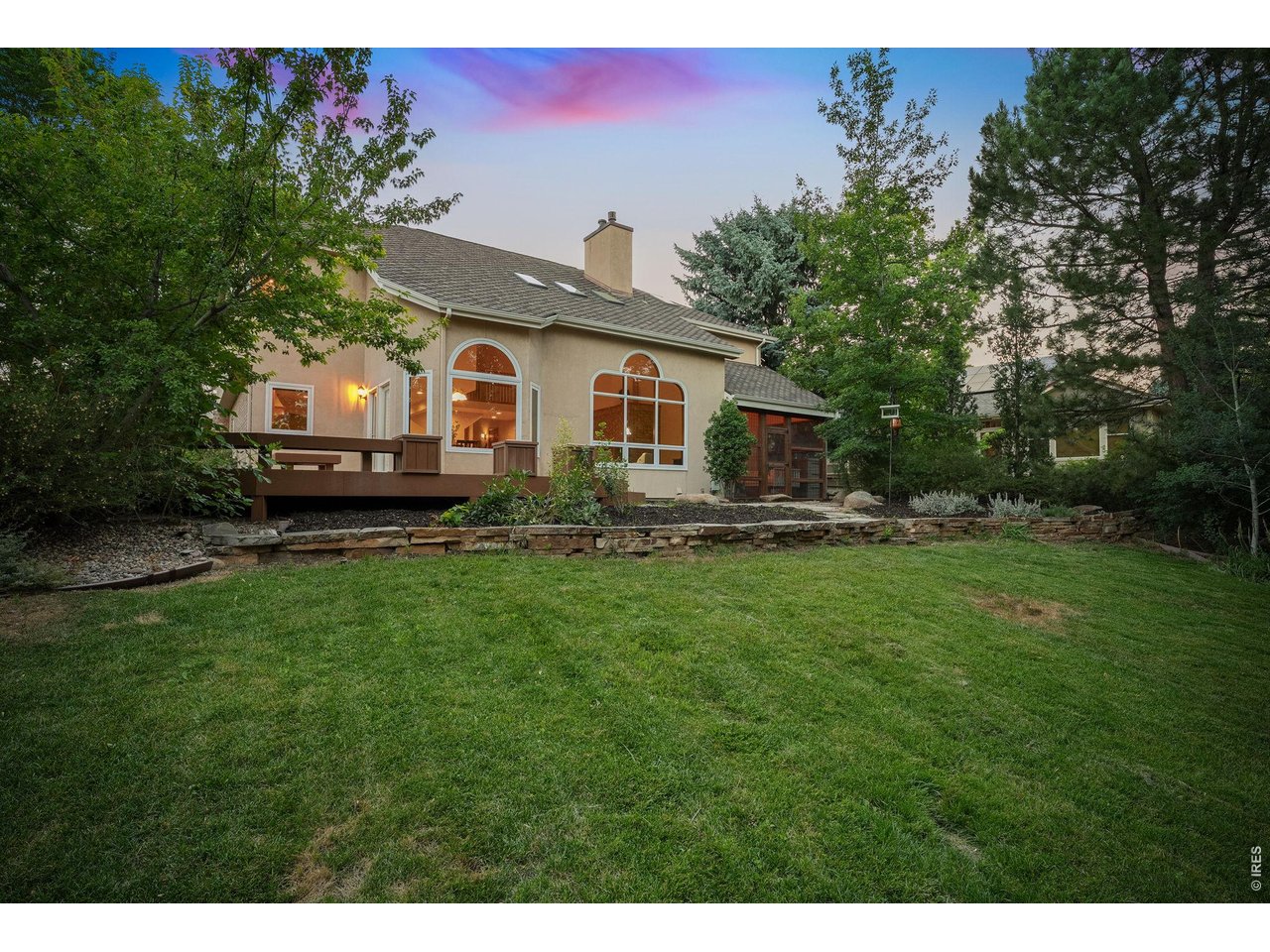 Property Photo 47 From the expansive deck to the lush lawn, every inch of this backyard is designed to be enjoyed.