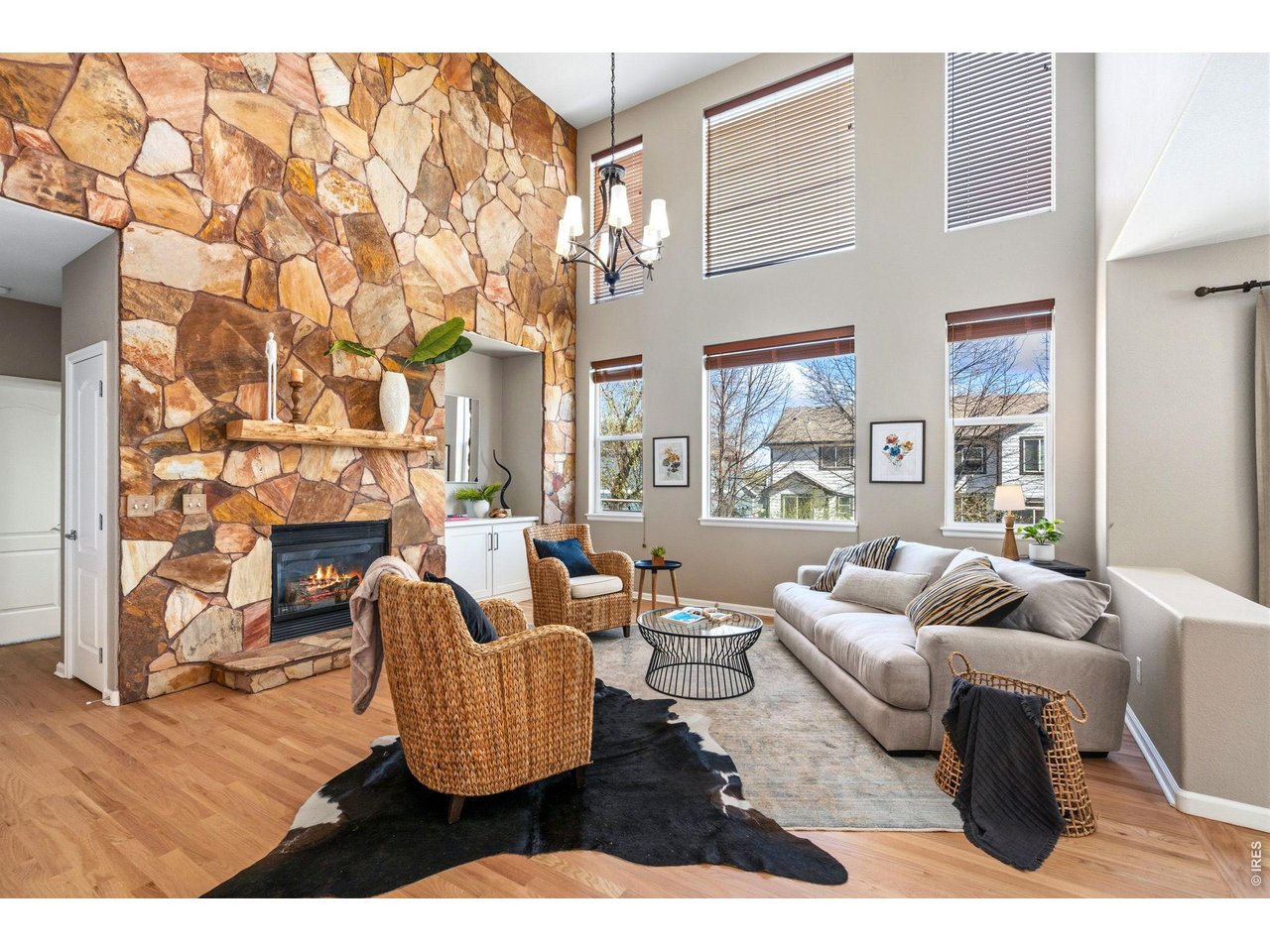 Property Photo 5 Open living with commanding flagstone fireplace and mantel.