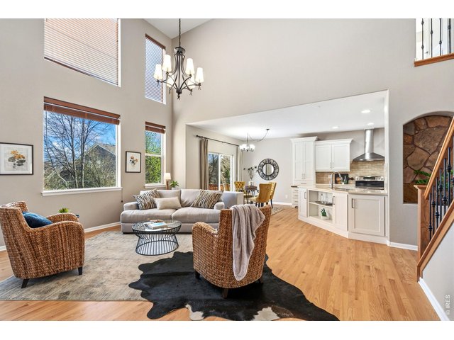 Property Photo 8 High ceilings with east morning light on the back of the home.