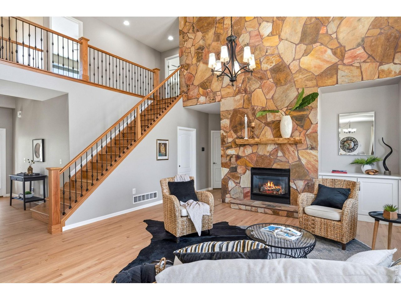 Property Photo 9 Main floor living room with 2 story windows overlooking the backyard.