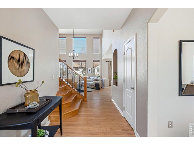 Property Photo 18 The bright and open entry opens into the 2 story living room.