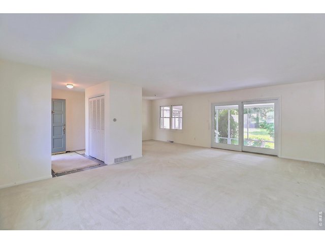 Property Photo 6 Open Floor Plan of the Living Room and Dining Room