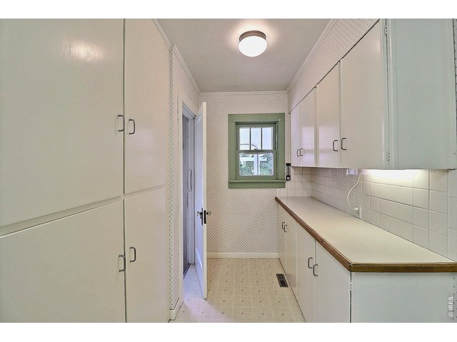 Property Photo 10 Kitchen Pantry with Lots of Cabinets and Built-Ins Plus a Serving Area