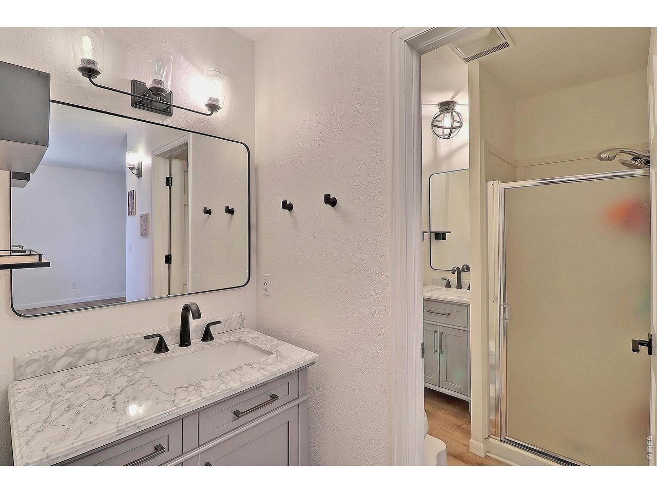 Property Photo 21 Primary Bathroom with 2 Separate Sinks and Shower