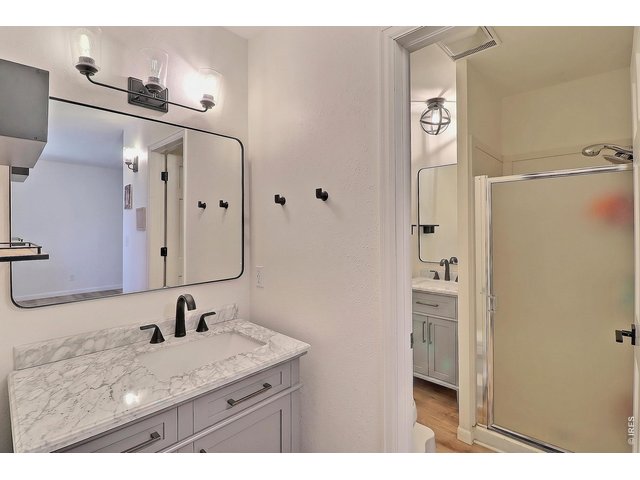 Property Photo 21 Primary Bathroom with 2 Separate Sinks and Shower