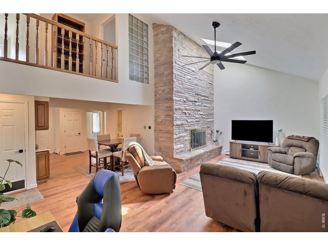 Property Photo 28 Open Floor Plan with Gas Fireplace in Living Room
