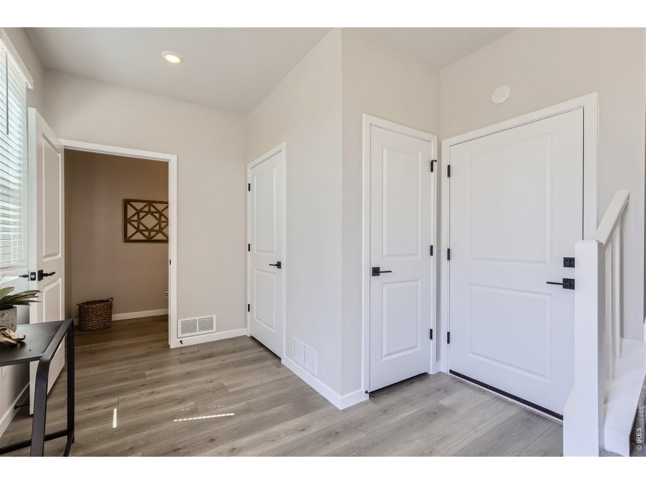Property Photo 3 Entrance foyer with access to garage & powder room