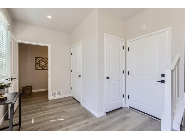 Property Photo 3 Entrance foyer with access to garage & powder room