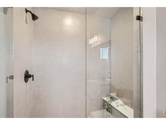 Property Photo 12 Primary Bedroom walk-in shower