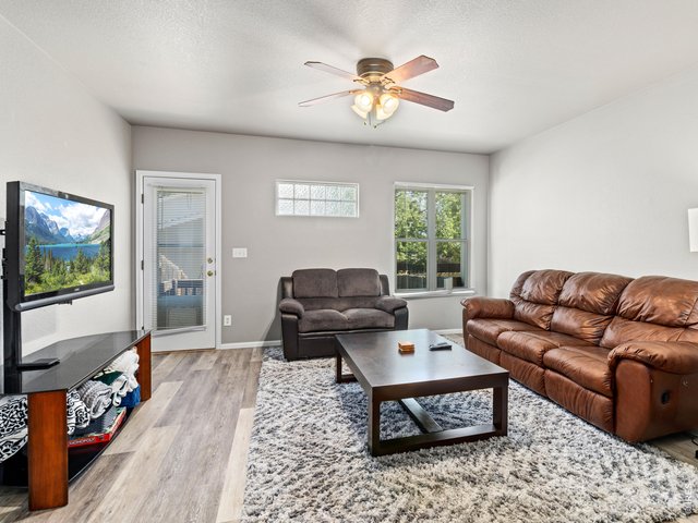 Property Photo 7 Living room opens to fenced back yard
