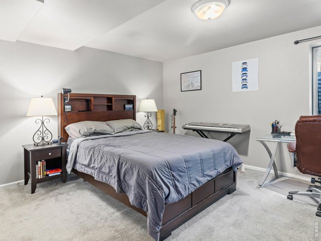 Property Photo 11 oversized private primary suite with its own bath, walk in closet and laundry room on the lower level