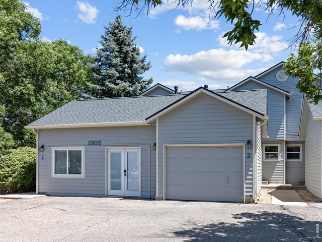Property Photo 1 Welcome home to this conveniently located two-story townhome in desirable west Fort Collins. Oversized one-car garage provides plenty of room for parking and extra storage.