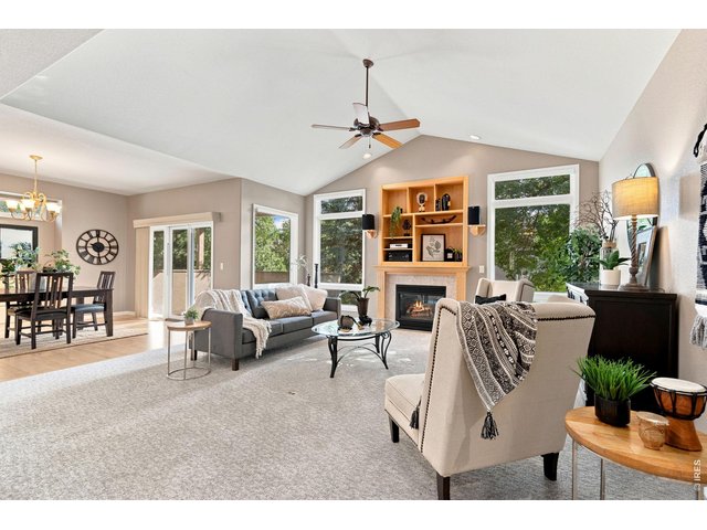 Property Photo 6 Vaulted living room opens to kitchen/dining.