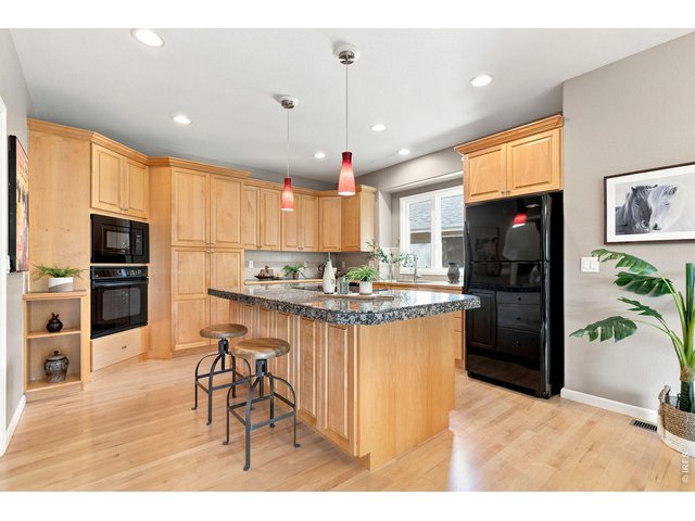 Property Photo 12 Granite island in kitchen.