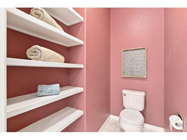 Property Photo 20 Built-in shelving in primary bathroom.