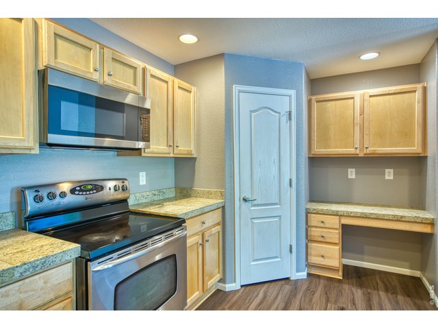 Property Photo 6 Walk-in pantry, desk with drawers & storage cabinets above.