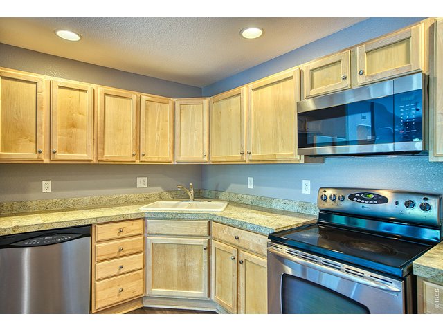 Property Photo 5 Stainless steel appliances & double sink.