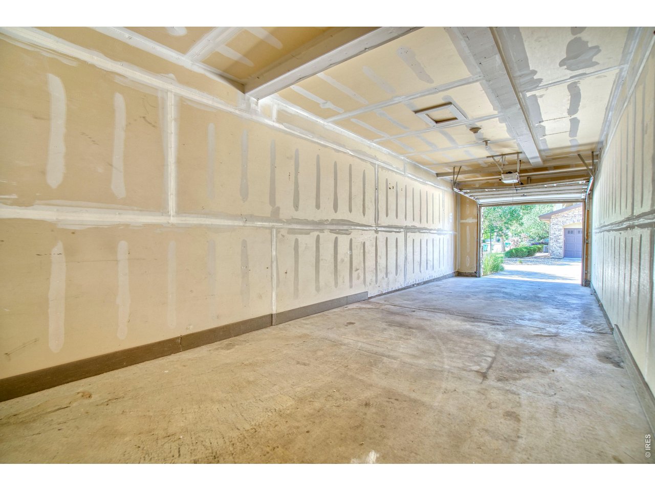 Property Photo 28 2-car tandem garage is great for your vehicles, bikes, paddleboards & other gear.