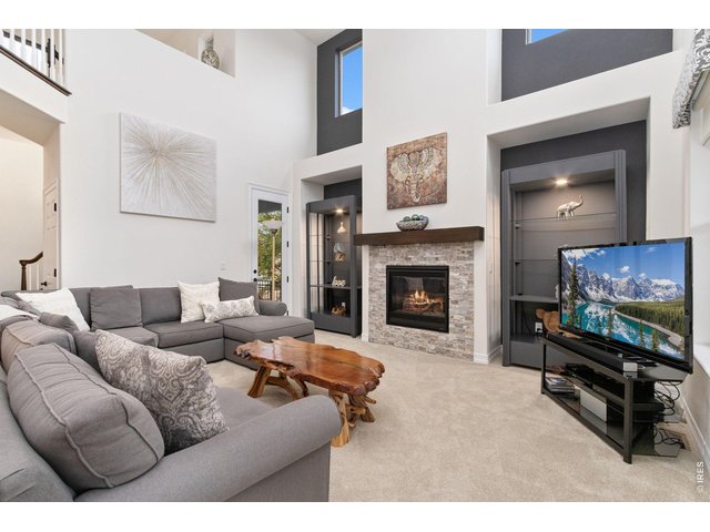 Property Photo 8 Great room with beautiful space for decorative shelving; door leads you to exterior porch.