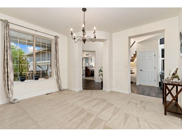 Property Photo 21 Dining room, with three areas of entry - from the front of the home, main floor hallway and kitchen.