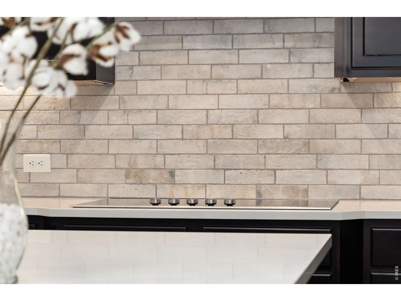 Property Photo 18 Kitchen offers a glass top easy to clean electric stove and beautiful backsplash.