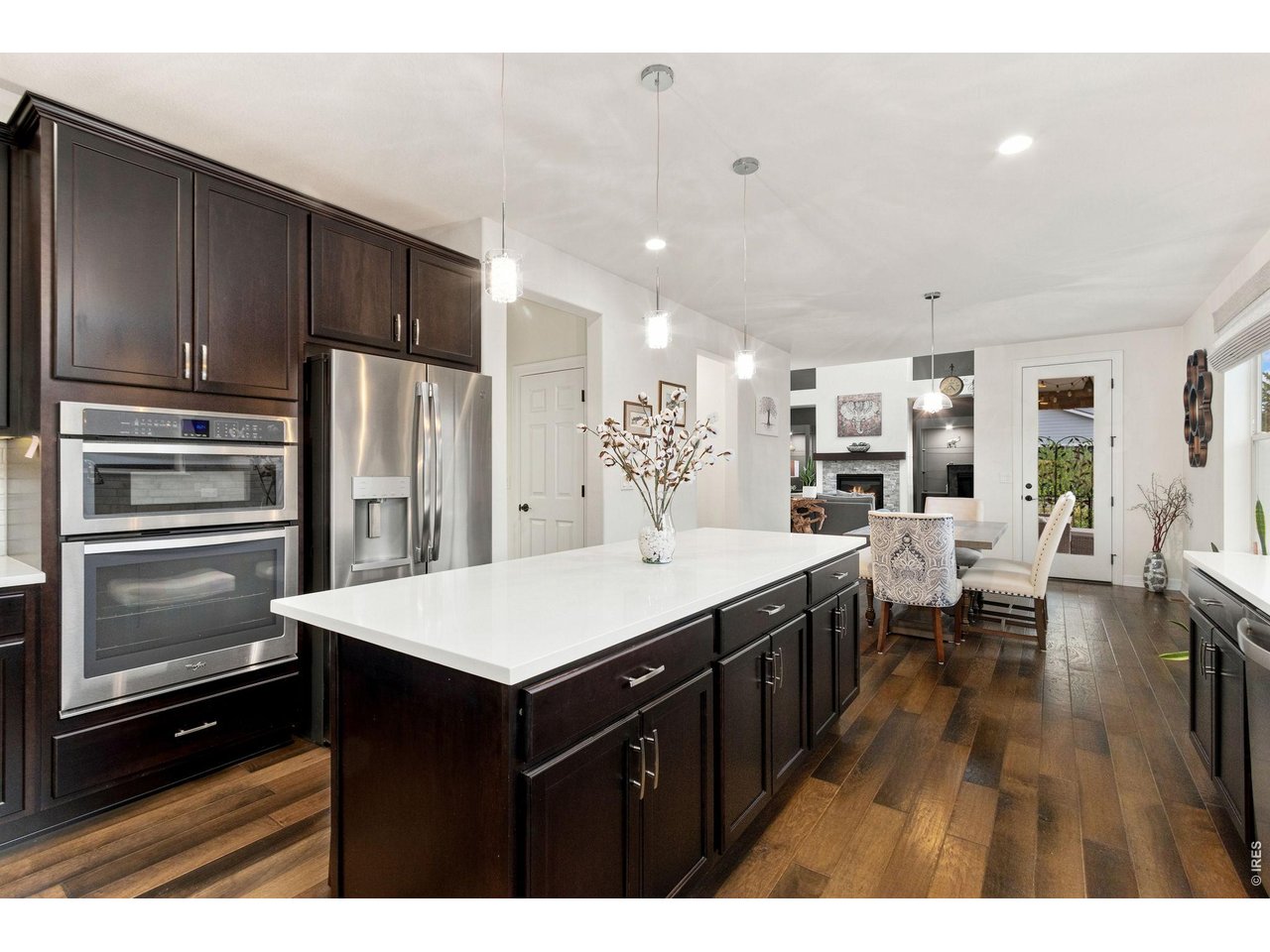 Property Photo 15 Large kitchen island with beautiful quartz countertops and stainless steel appliances.