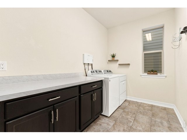 Property Photo 20 Laundry Room - Offers great cabinet and counter space, as well as a Clean Start Ozone system that improves quality and cleanliness in laundry.
