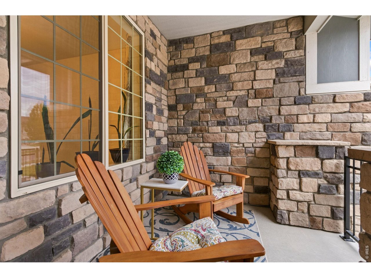 Property Photo 5 Inviting front porch, wonderful area to sit and enjoy the day and evening.