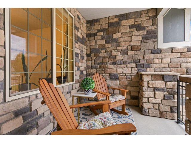 Property Photo 5 Inviting front porch, wonderful area to sit and enjoy the day and evening.