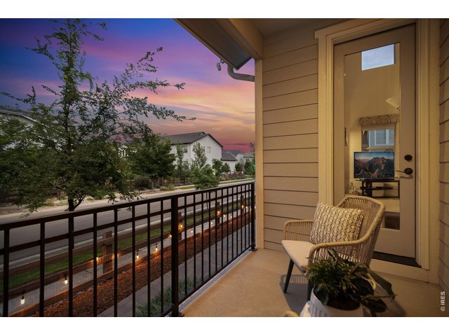 Property Photo 47 Evening on the cozy side porch that provides direct access to the main floor great room.