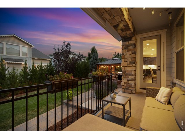 Property Photo 44 Evening on the back porch that leads into the kitchen.