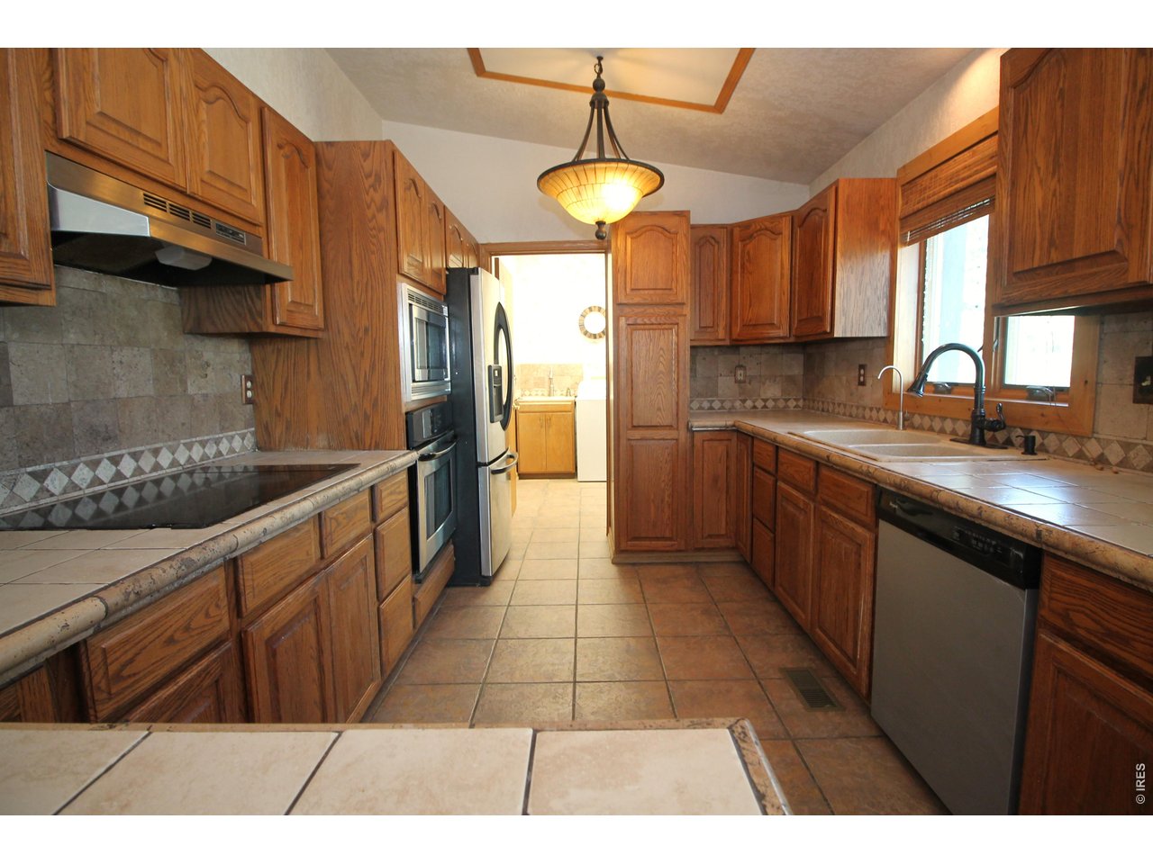 Property Photo 12 Kitchen, laundry and half bath through door
