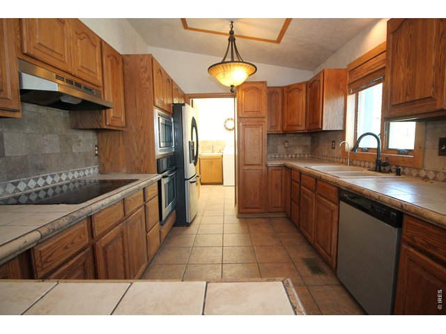 Property Photo 12 Kitchen, laundry and half bath through door